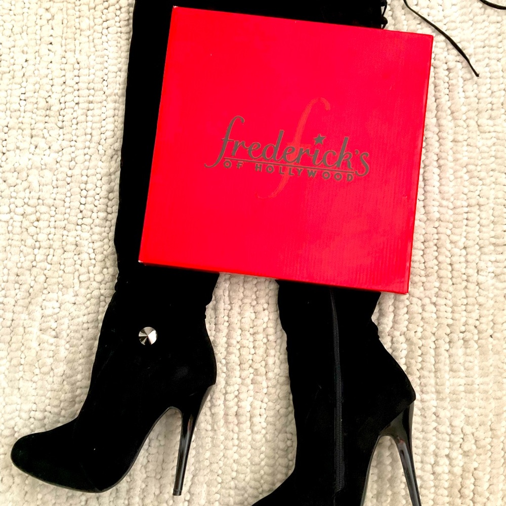 Frederick’s of Hollywood over the knee high heel boots.